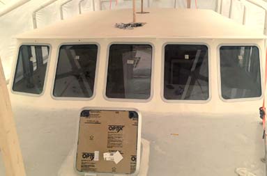 Slightly overhead shot of the deck with the hatch sitting below the 5-framed windows
