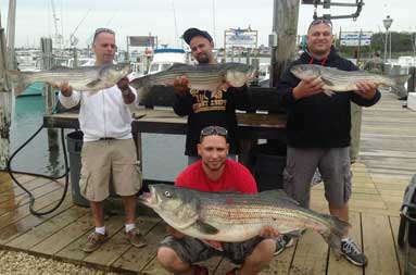 OThe guys pose for a pic with this morning's catch