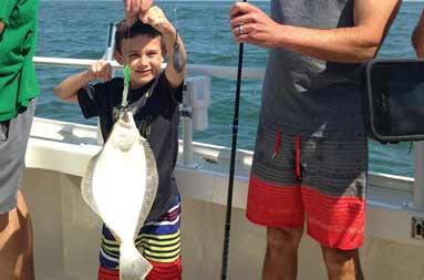 Capt Mike and his song holding a fluke