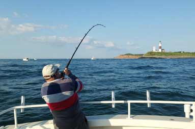 One of the guys reeling in a 41 lb bass