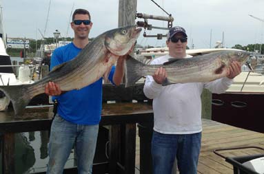 One of the guys, AJ, hooks into a 30+ pound bass.