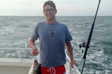 One of the guys with a fish on their line