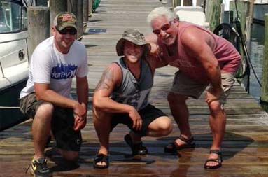 Kenny and some of the other guys pose with their bass.
