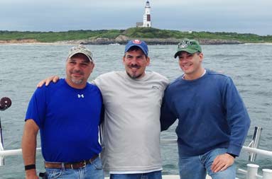 The group of guys smiling for a photo