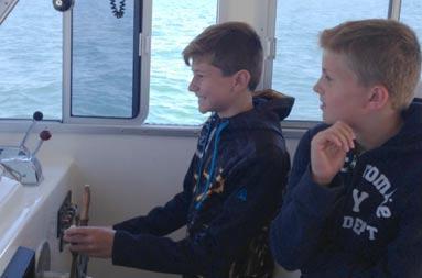 The boys were having a blast steering the boat home.
