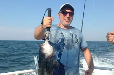 One of the guys holding up his catch