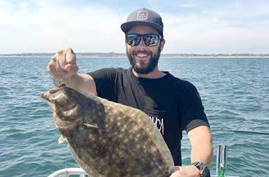 One of the guys holding up a fluke that was later released