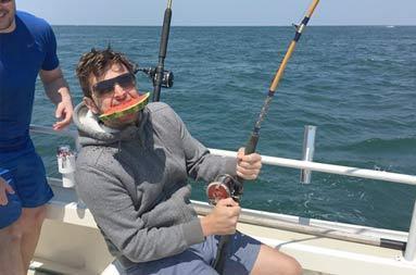 One of the guys on the reel with watermelon in his mouth