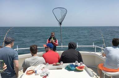 Everyone hanging out on deck waiting for a catch