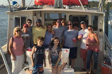 View of the boat docked with group of friends aboard the November Rain, including Capt Steve.